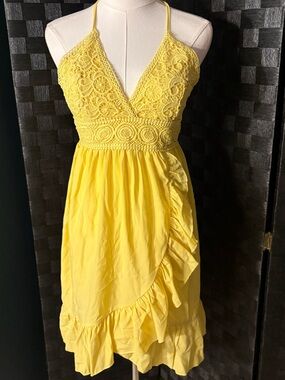 yellow EcoWish sundress with a crochet bodice and ruffle wrap skirt